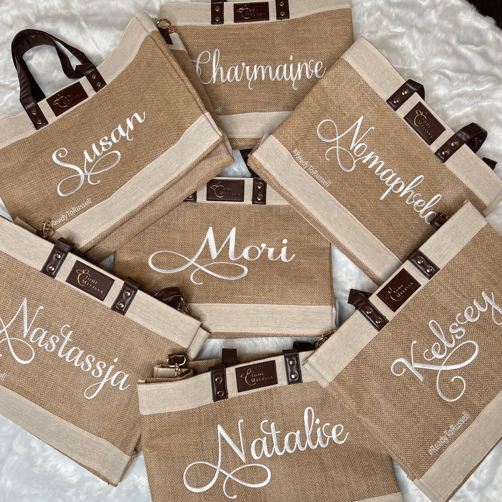 Custom embroidered jute tote bag with adjustable crossbody strap and lined interior
